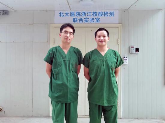 浙大一院分子检验室组长余斐和检验师刘衍超